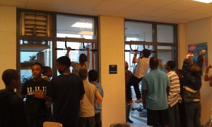 The kids showing off their pull-up prowess on their donated pull up bars